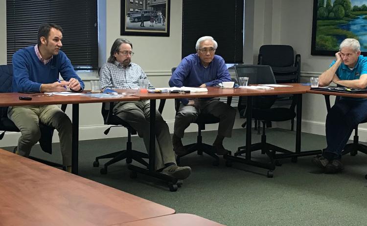 Elbert Memorial Hospital Authority Board members (L-R) Daniel Graves (chair), Max Black, Dr. Glenn Poon and Tom Steele talk at Friday’s meeting of the authority. (Photo by Jones).