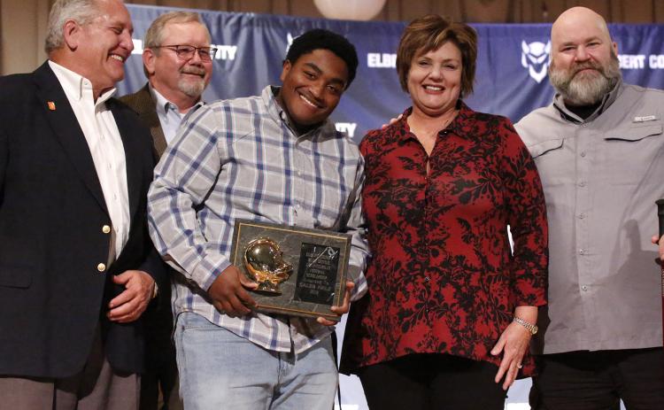 Blue Devil senior Caleb Hale (center) reacts as he accepts the 2019 L.C. Piccirillo Scholarship and Football Award during the Elbert County Athletic Department’s Fall Sports Awards Program Monday night Dec. 9 in the Elbert County Middle School Auditorium. Pictured with Hale (L-R) are Ciro Piccirillo, Ed Fendley, Nannette Piccirillo and Lenny Piccirillo. (Photo by Cary Best)