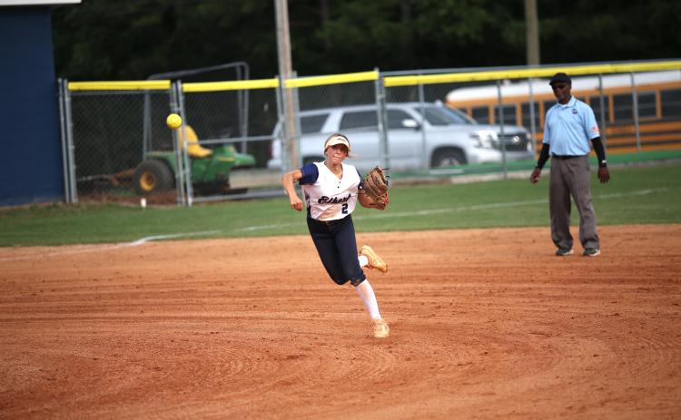 Elbert County Lady Devil senior Gracie Brady throws a runner out at first during a 2022 matchup with Stephens County. Elbert is scheduled to kick off the 2023 Softball season on the road against Stephens County Aug. 4. (File photo by Wells)