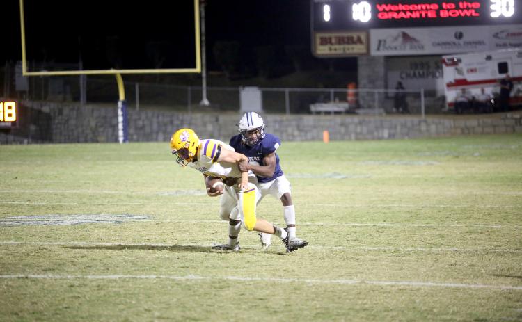 Senior Isiah Davis makes an open-field tackle on the Athens Christian quarterback. (Photo by Wells)