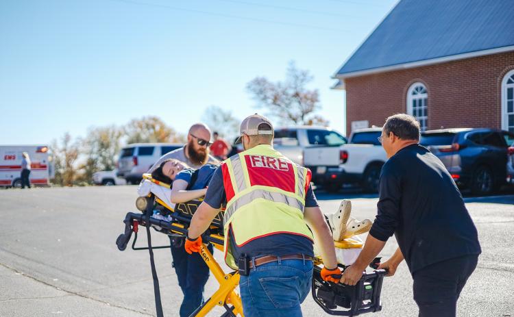 Members of Elbert County Emergency Services, the Elbert County Fire Department, Elbert County Sheriff's Office and first responders helped take part in an active shooter training drill at Pleasant Grove Baptist Church in Bowman Nov. 18. (Photo by Leslie Corbett) 