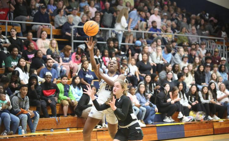 Zy Belcher floats a shot over a Tallulah Falls defender during Elbert’s loss to the Lady Indians Jan. 26. (Photo by Wells)