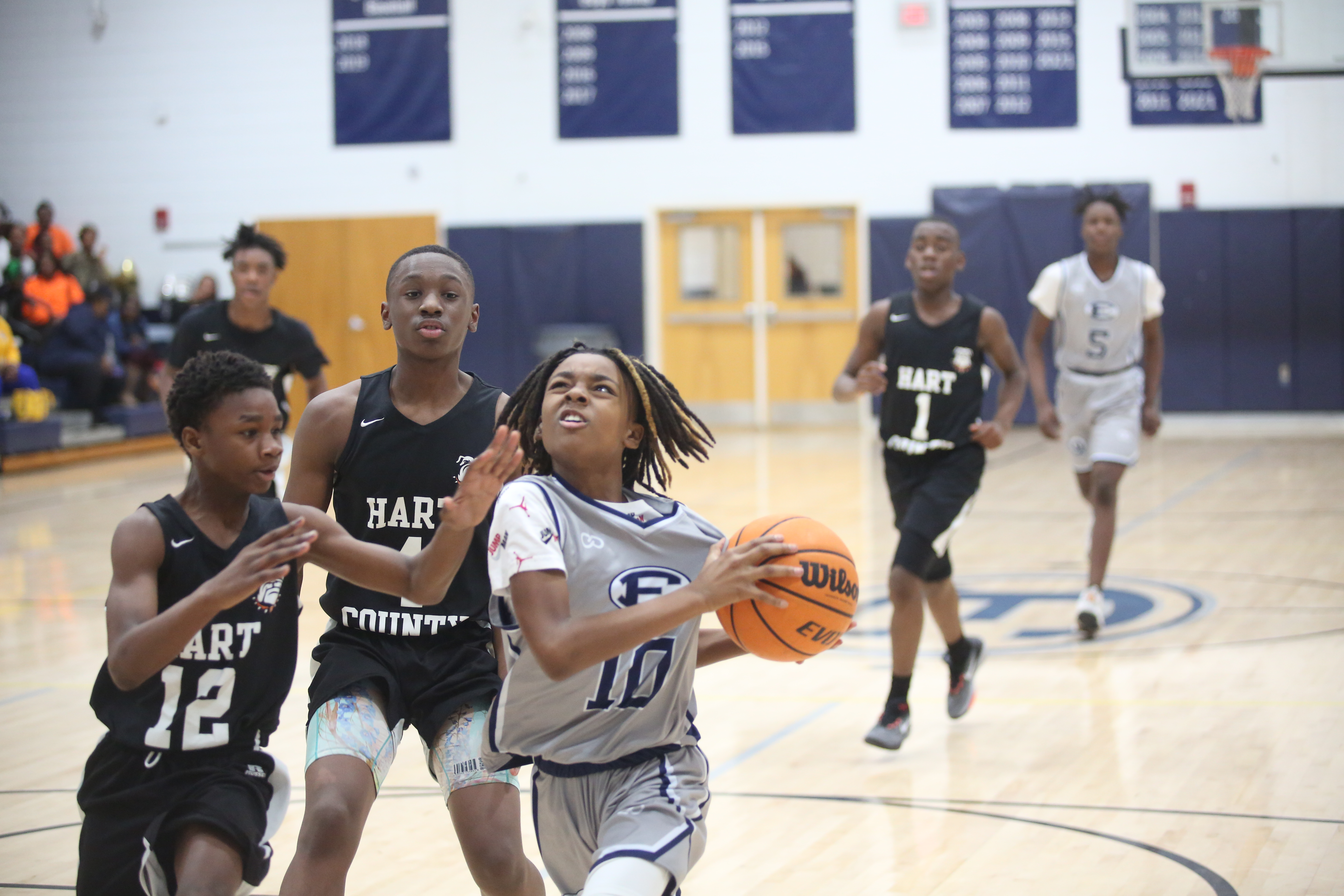 Tavaris Willis guards the ball as he drives to the basket. (Photo by Wells)