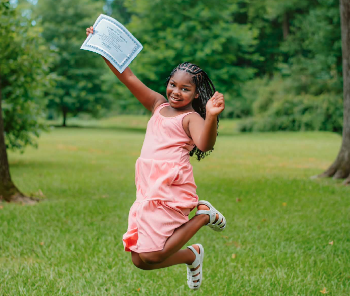 Bree Carroll-Jave jumps for joy after her adoption was finalized.  (Photo courtesy of Victoria Carroll-Jave)