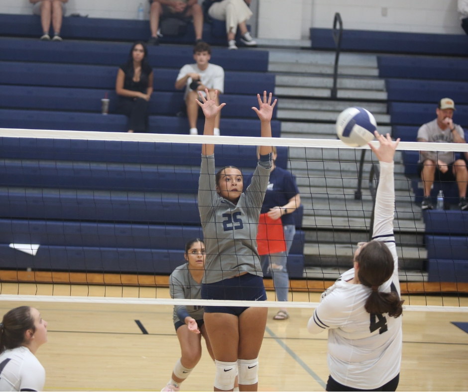Melanie Badillo goes up for a block. (Photo by Bo Underwood)