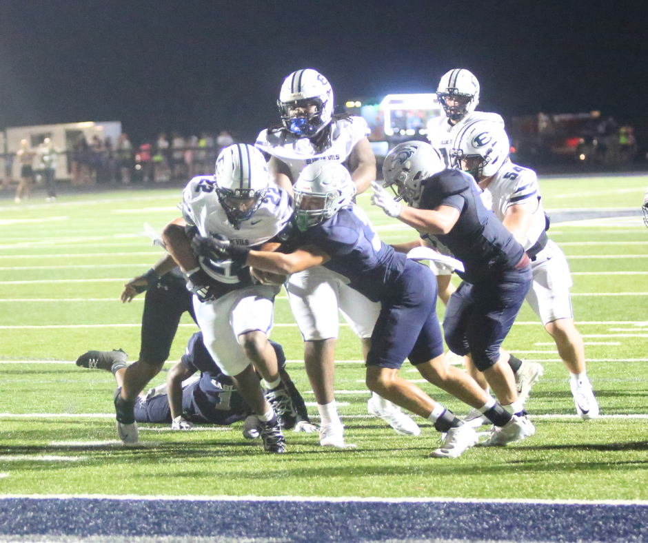 Petey Allen (22) drags defenders with him for a touchdown. (Photo by Bo Underwood)
