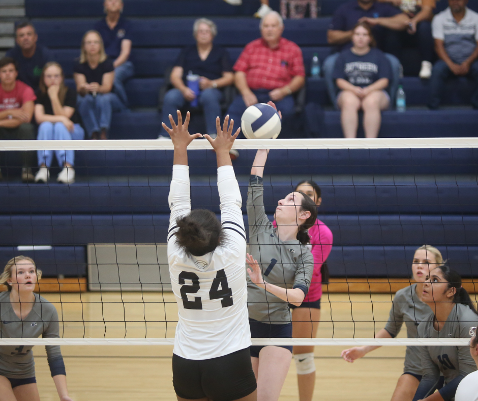 Peyton Roach hits the ball over the net. (Photo by Bo Underwood)