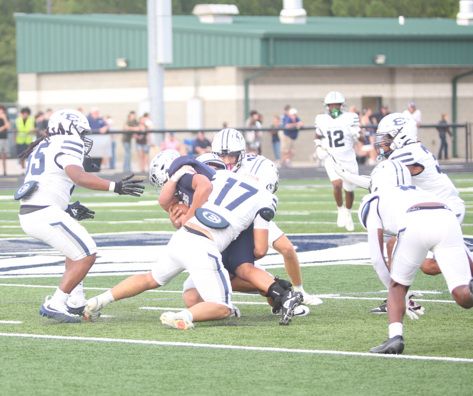 Kaden Montgomery (17) brings down the quarterback. (Photo by Bo Underwood)