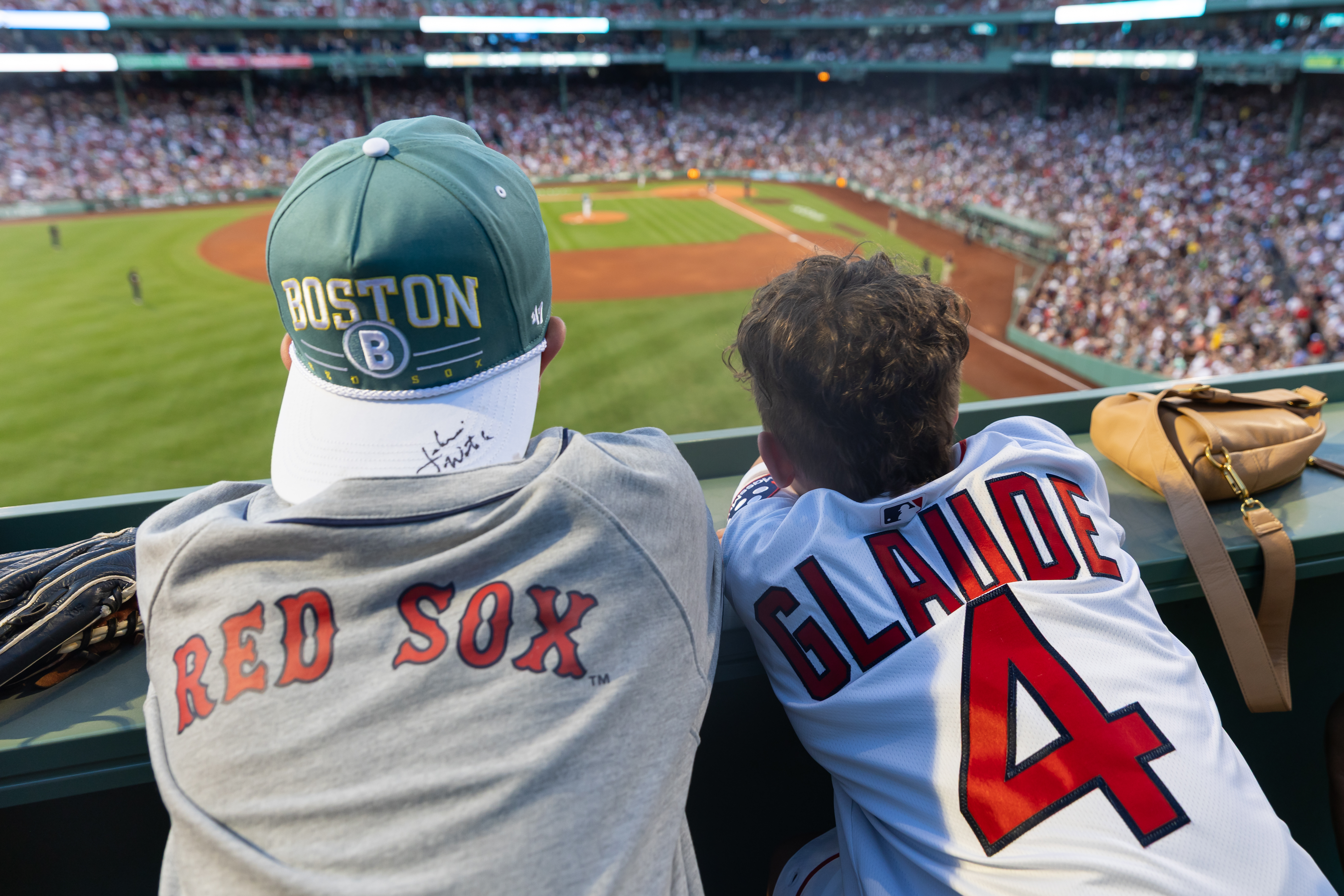 Paxton Glaude (right) and Spencer Etheridge (left) look on from the Green Monster at Fenway Park. (Photo by Dream On 3)