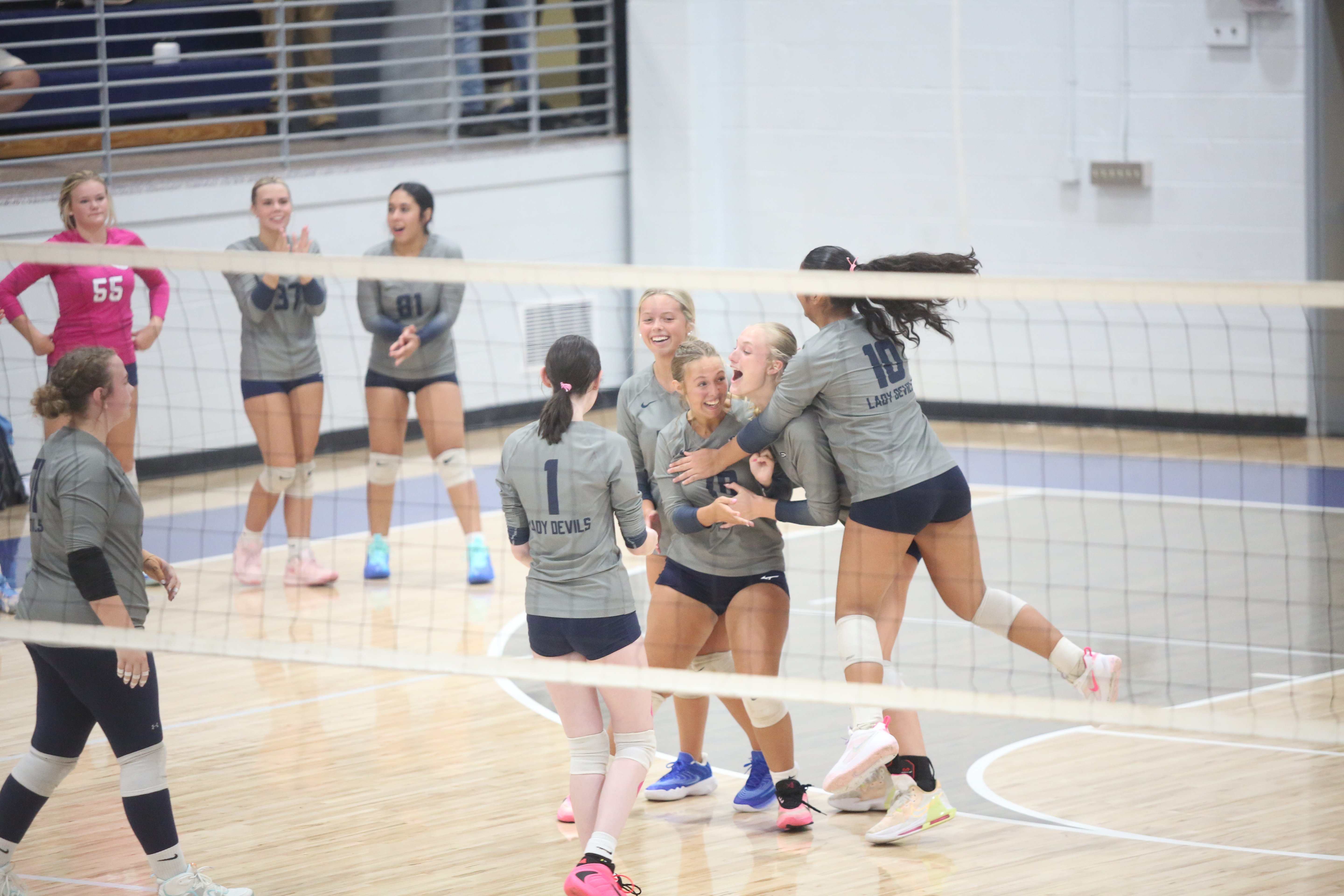 Elbert County volleyball players celebrate a point. (Photo by Bo Underwood)