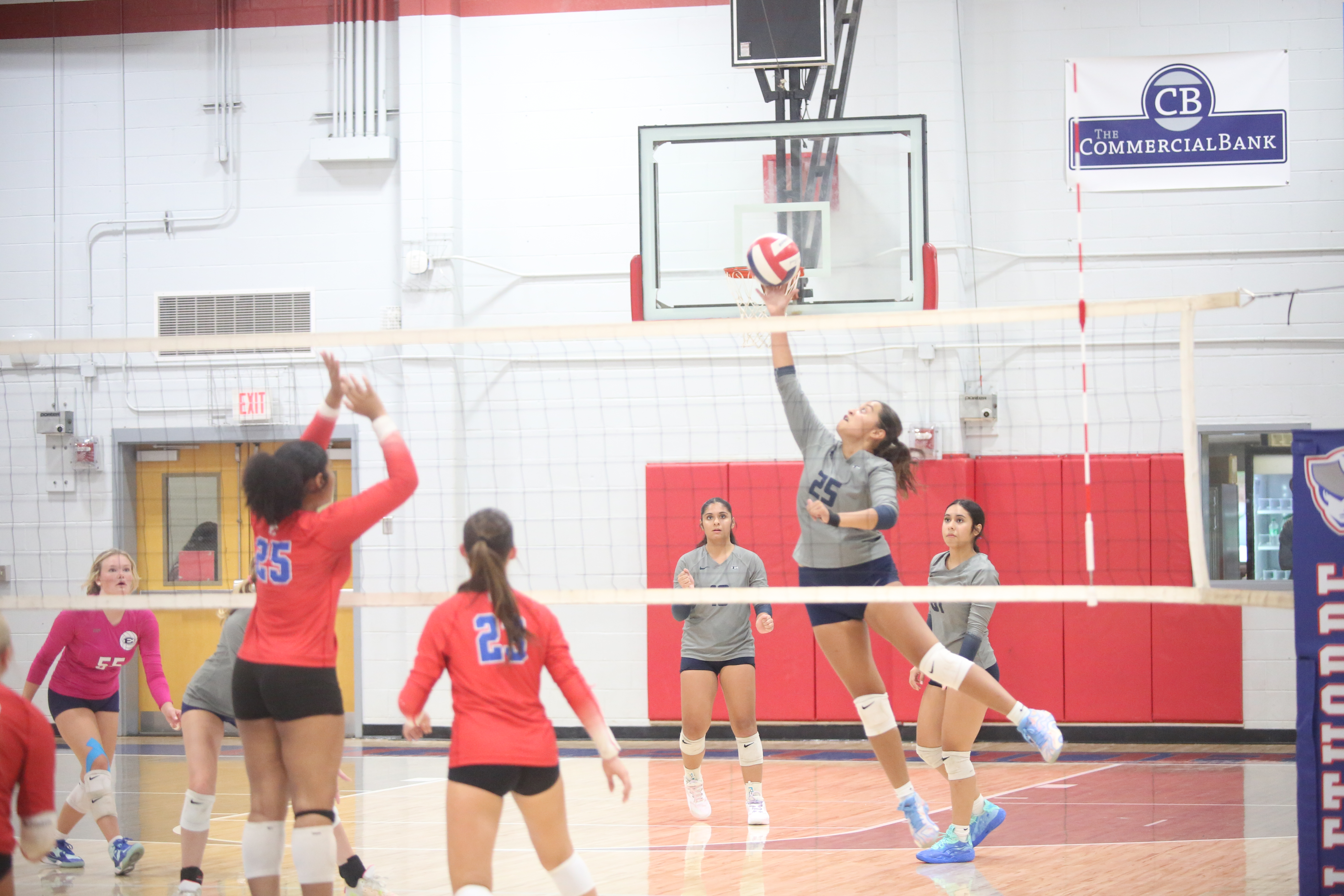 Melanie Badillo hits the ball over the net. (Photo by Bo Underwood)