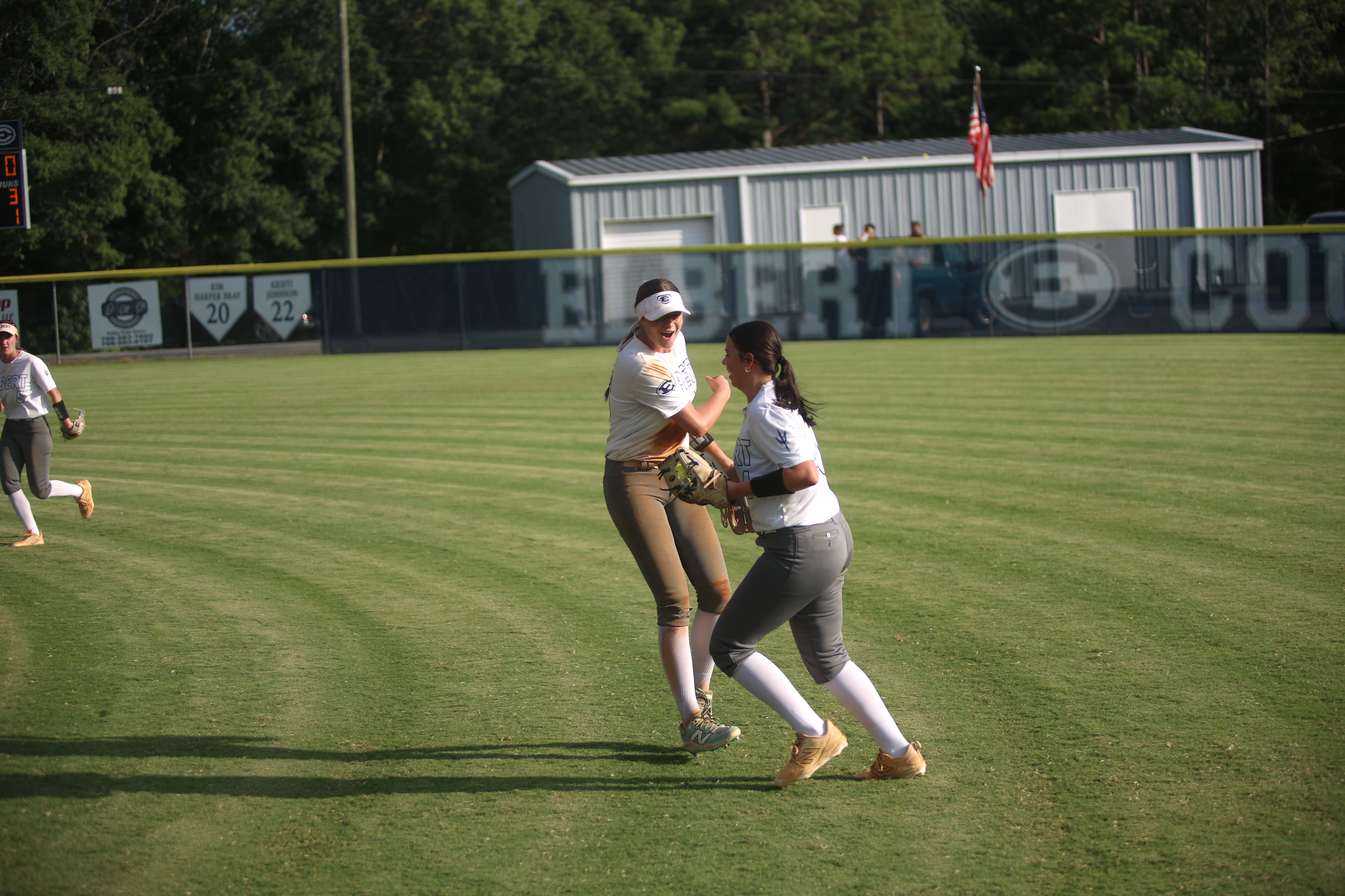 Carlee Brown celebrates a diving catch with teammate Bryleigh Dickerson. (Photo by Bo Underwood)