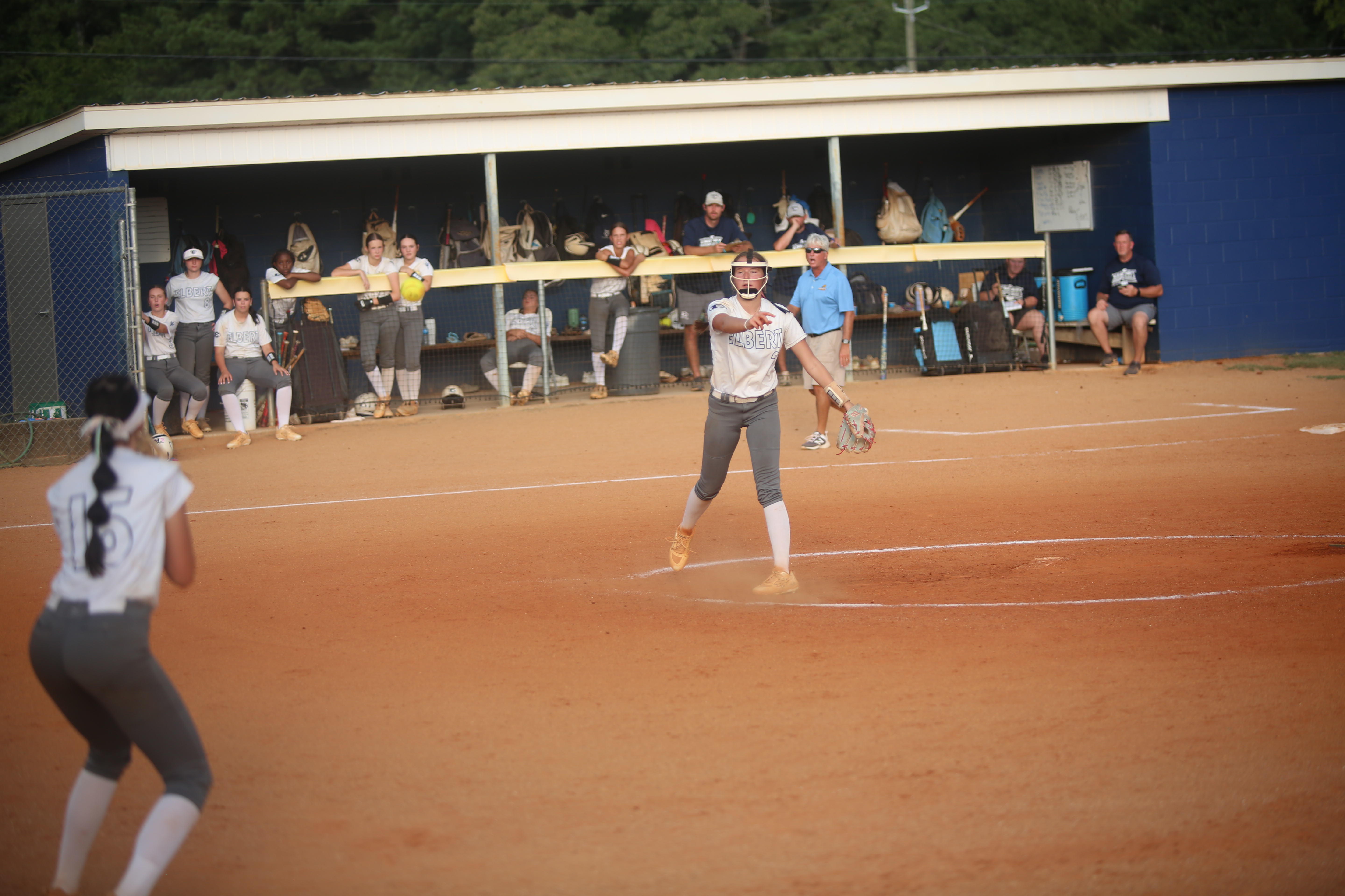 Ella Harris makes the throw to first base Kamille Webb. (Photo by Bo Underwood)