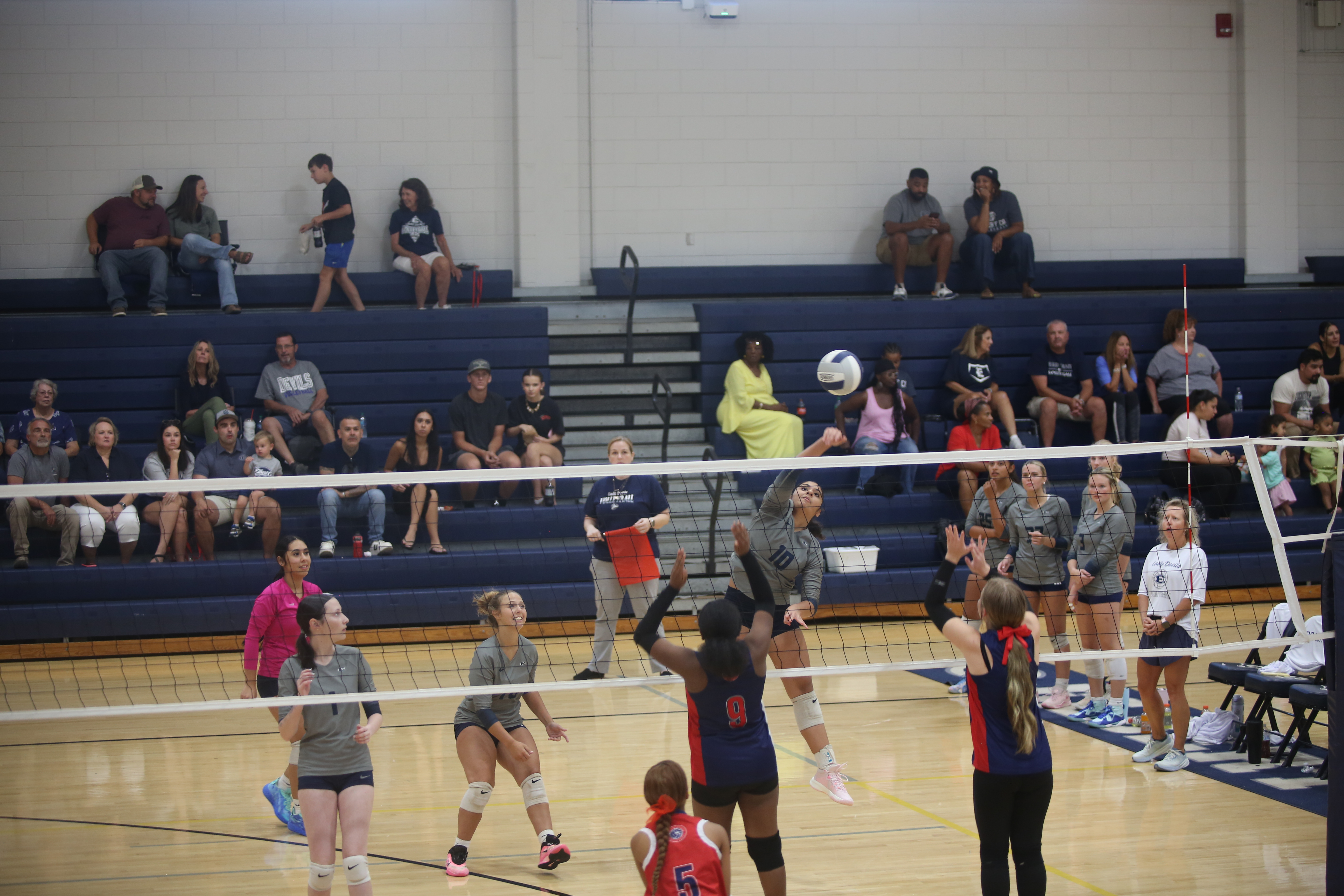 Alexa Vargas hits the ball over the net. (Photo by Bo Underwood)