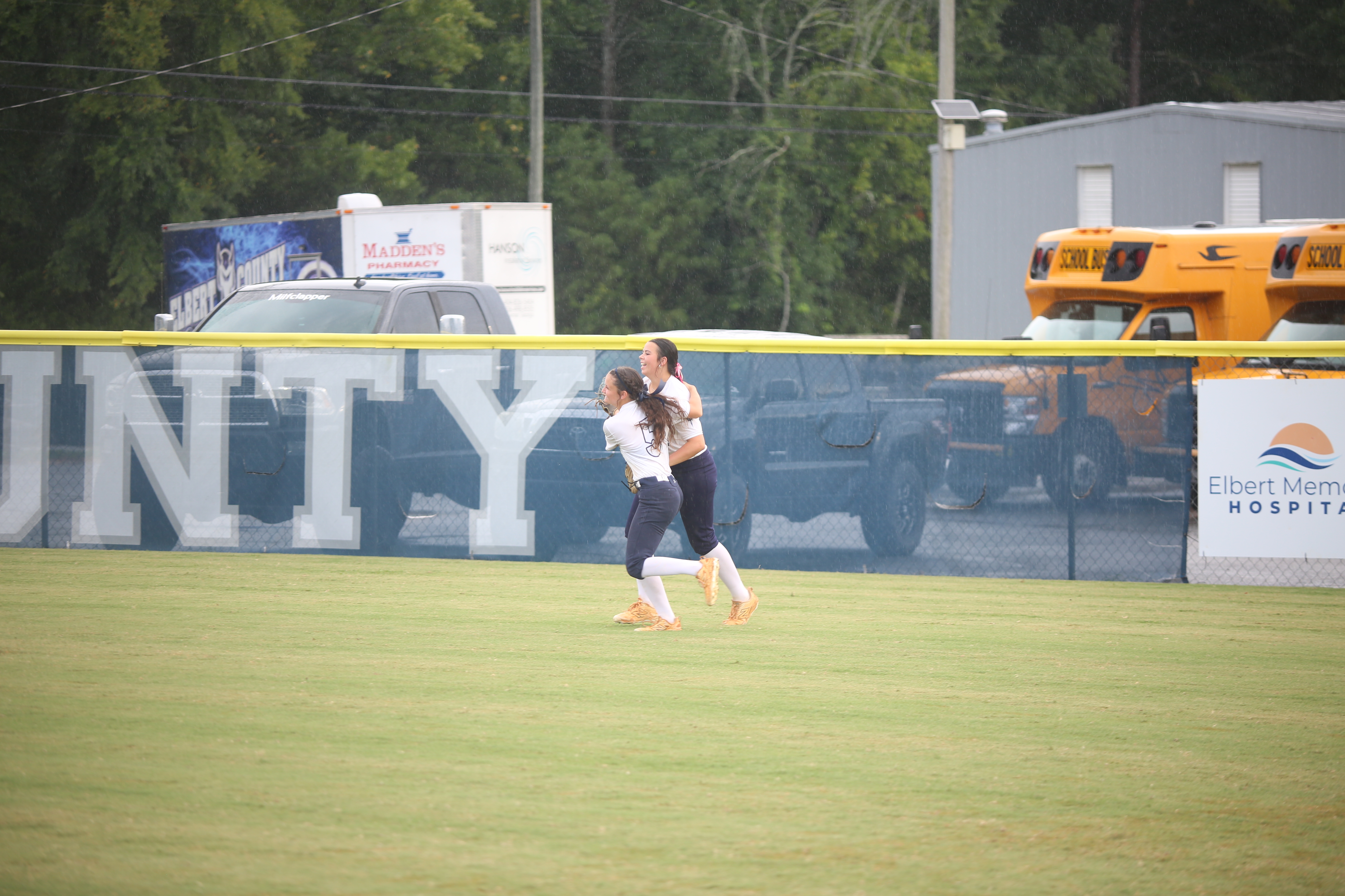 Rightfielder Carlee Brown celebrates a nice catch with centerfielder Bellamy Nash. (Photo by Bo Underwood)