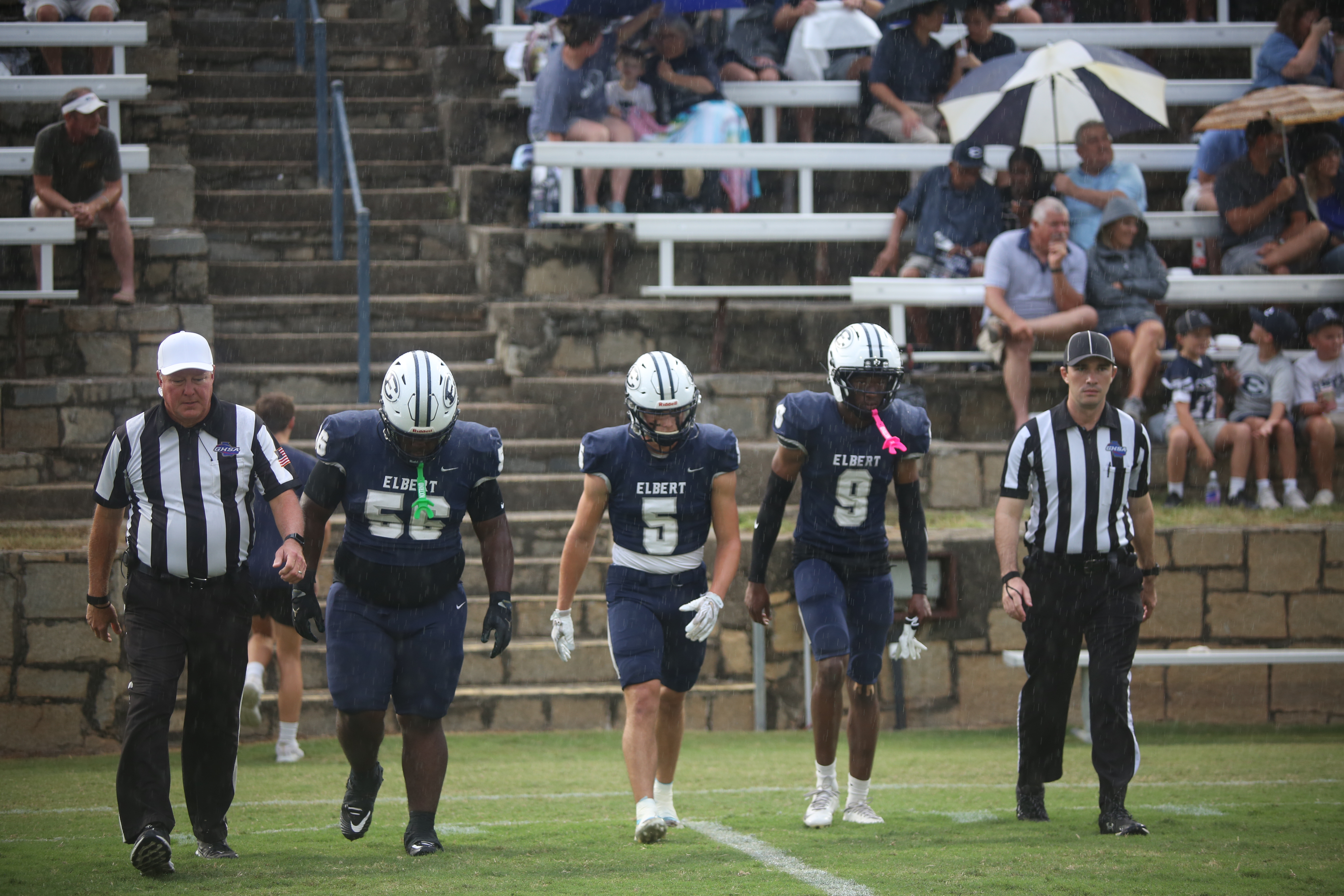Elbert County's captains, (L-R) Jerrell Sims, Jackson Black and Braylen Huff, take the field. (Photo by Bo Underwood)