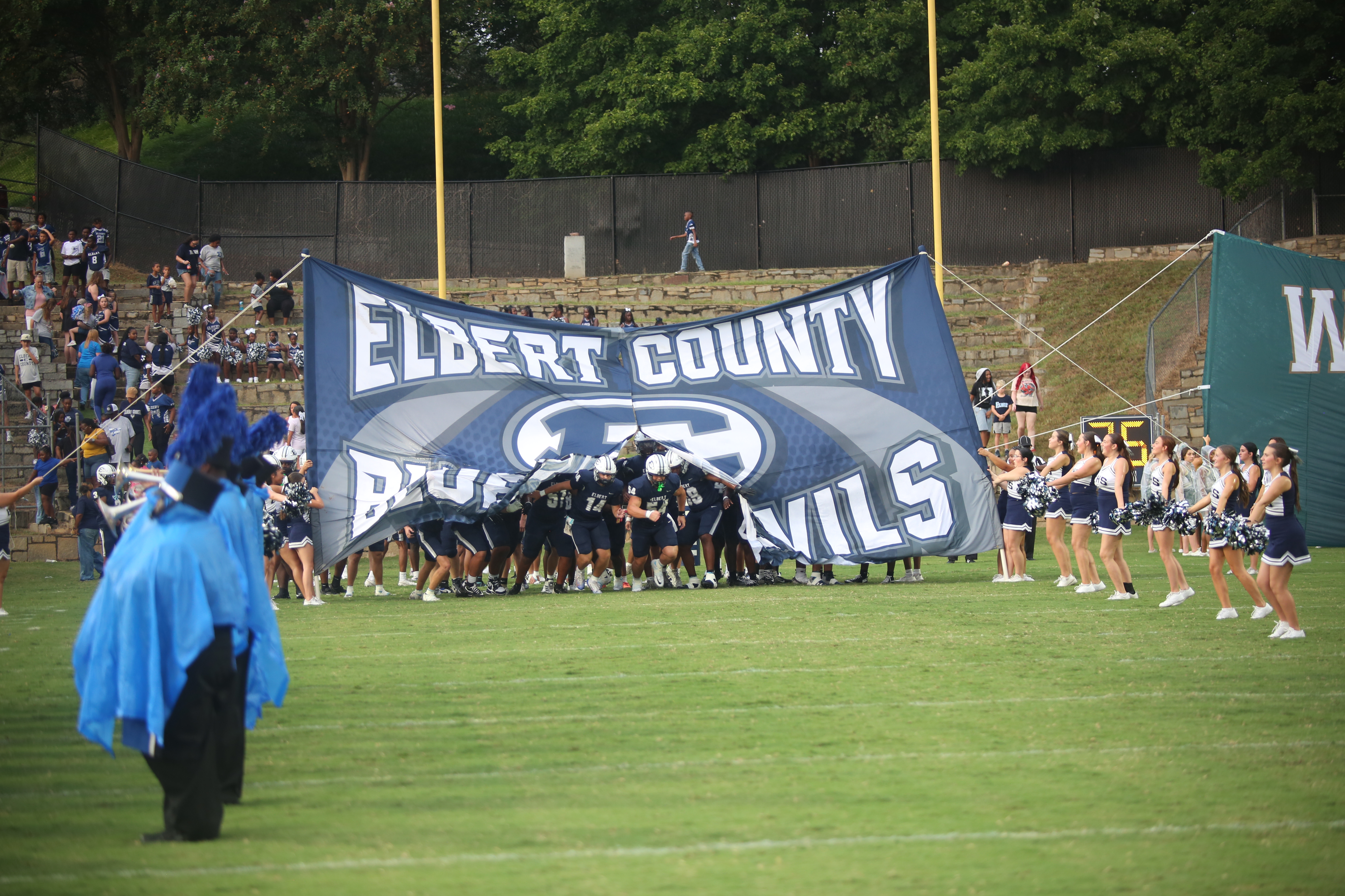 The Elbert County football team runs out for the first time at the Granite Bowl in 2026. (Photo by Bo Underwood)