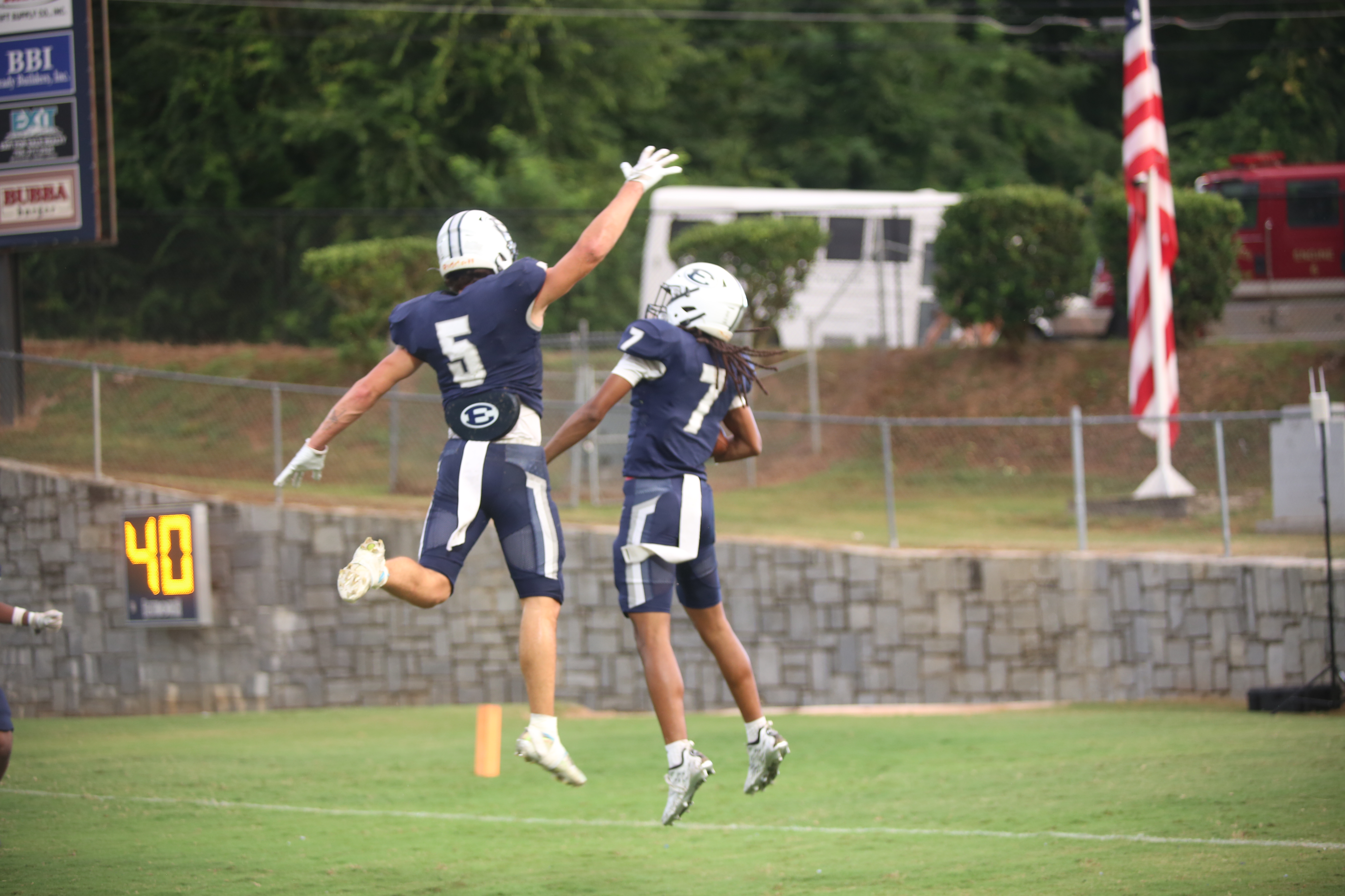 Zaylen Moon (7) celebrates his touchdown with Jackson Black (5). (Photo by Bo Underwood)