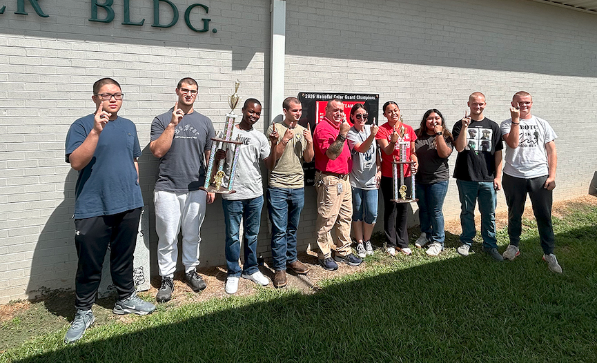 Pictured with the state-championship trophy and showing off their new state-championship rings are (L-R) JROTC cadets Daniel Nguyen, Jacob Brown, Atorrian Small, Colton Mabry, assistant drill coach Daniel Ulrich, head drill coach Nicole "Drill Mama" Ulrich, cadets Ariel Moncallo, Nalleli Rodriguez, Wyatt Moon and Landon Bowman. (Photo by Bo Underwood)