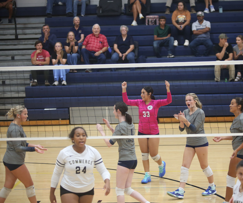 Sophia Vargas and Sabrina Ray celebrate after scoring a point. (Photos by Bo Underwood)