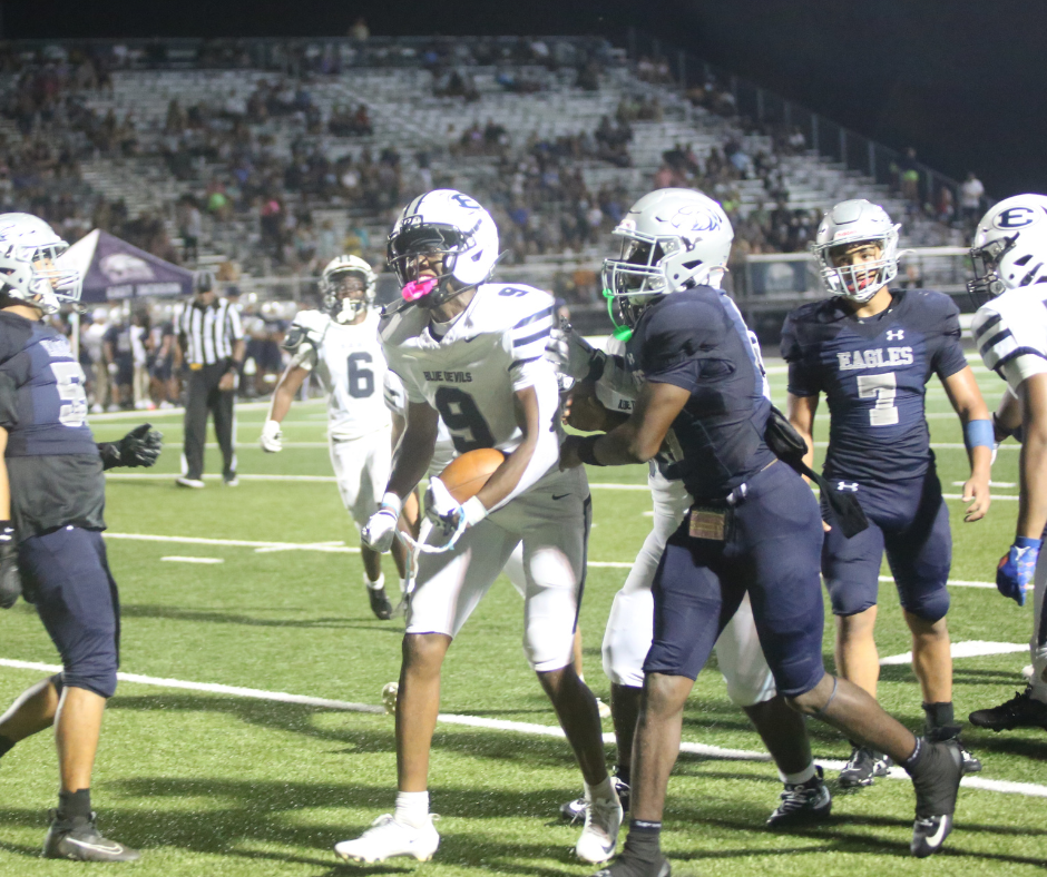 Braylen Huff (9) celebrates an interception. (Photo by Bo Underwood)
