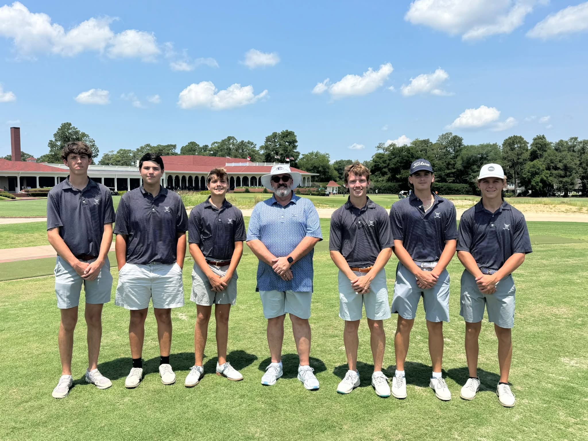 The Elbert County boys' golf team (pictured alongside ECCHS principal Buddy Winborne, middle) competed at the invite-only 2026 Boys High School Golf Invitational at Pinehurst Resort from July 18-19. (Photo courtesy of Larry Kesler) 