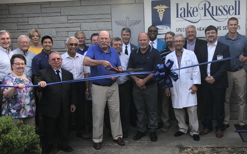 Elbert Memorial Hospital CEO Kerry Trapnell, on the right, at the recent ribbon cutting for the new Adams Medical Office Building. Shown at the ribbon cutting are (L-R) Jannie Wade (Clyde Adams’ niece), Dr. Mark Daniel, Mary Moon (Clyde Adams’ niece), Dr. David Mize, Patsy Whaley, Executive Director of Office of Rural Health, State of Georgia and Stabilization Grant Coordinator, Dr. Jonathan Poon, Rev. Thomas Moon (Clyde Adams’ nephew), Dr. Glenn Poon, Tom Steele, Dr. Louis Fernandez, Sid Adams, Dr. Dan McA