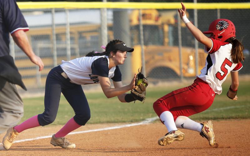 Junior Lady Diamond Madelyn Dias (left) tags Lady Redskin Cara Mayfield in the fifth inning of Elbert County’s 3-2 Region 8-AA win over Social Circle Sept. 12 on King Field in Elberton. (Photo by Cary Best)