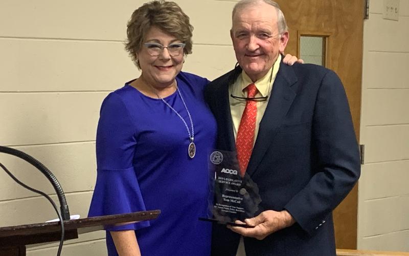 Representative Tom McCall received the 2019 Legislative Service Award from Debra Nesbit from the ACCG at the BOC meeting Oct. 16 (Photo by Scoggins).