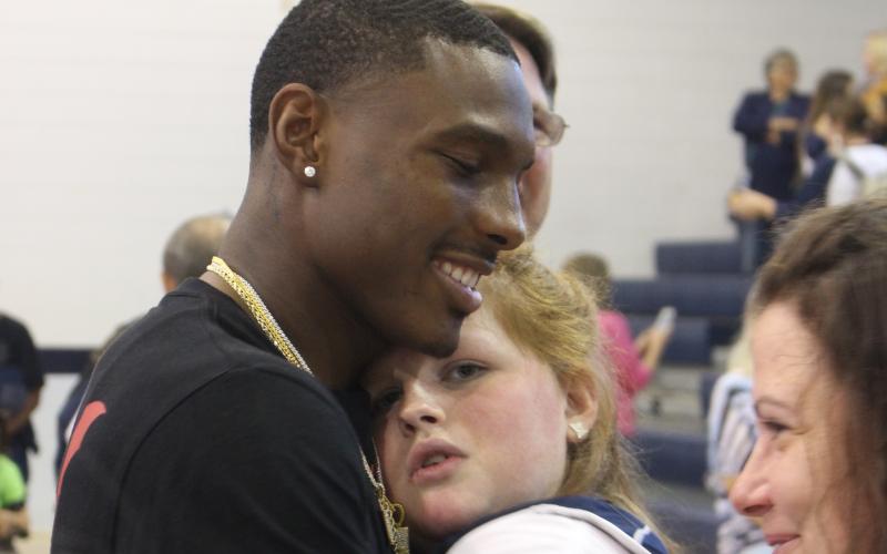 Kansas City Chiefs wide receiver Mecole Hardman surprised everyone by showing up at Elbert County Middle School Friday after a Thursday night NFL game in Denver. Among the many who got to greet Mecole was Marti Love Terrell.  Hardman also participated in a Friends Helping Friends basketball game. (Photo by Scoggins)