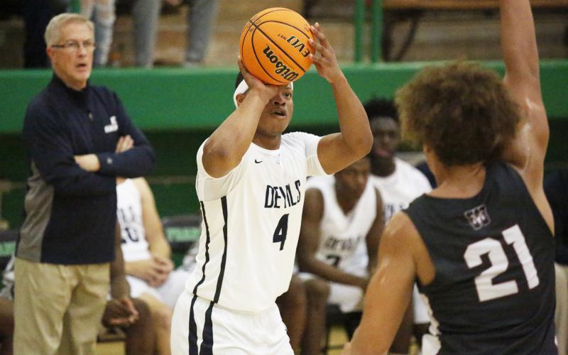 Blue Devil senior shooting guard D.J. Ardister shoots one of his four 3-pointers as coach Don Hurlburt looks on during Elbert County’s 76-60 win over Westside of Anderson, South Carolina Nov. 23 at Franklin County High School in Carnesville. (Photo by Cary Best)