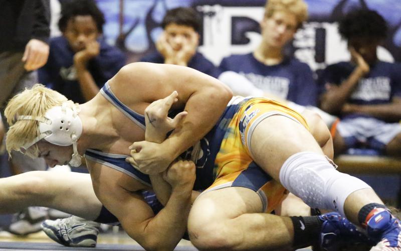 Mat Devil senior Brice Noggle pins Apalachee senior Brandon Bryant as his teammates (L-R) Trez White, Camden Harris, Nolan Johnson and Tyshawn Hughes look on during the Granite City Scramble Nov. 23 in the Inferno. (Photo by Cary Best)