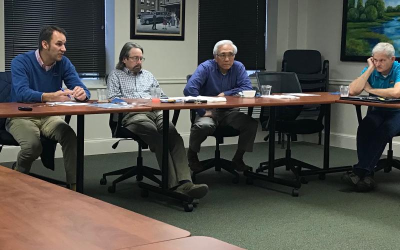 Elbert Memorial Hospital Authority Board members (L-R) Daniel Graves (chair), Max Black, Dr. Glenn Poon and Tom Steele talk at Friday’s meeting of the authority. (Photo by Jones).