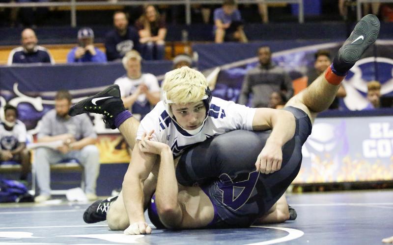 Mat Devil senior Gavin Brady (top) breaks the Elbert County High School career wins record by pinning Athens Christian’s 182-pound wrestler Joseph Ulrich Dec. 10 in the Inferno in Elberton. (Photo by Cary Best)
