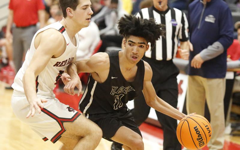 Junior point guard Jaden Brown (left) led the Blue Devils in scoring with 19 points in Elbert’s road win over Madison County. (File Photo by Cary Best)