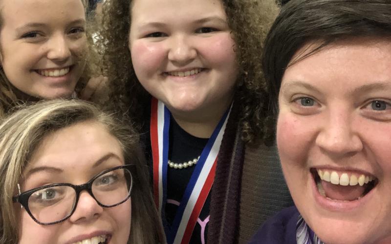 Shown are (L-R) Abigail Rushing, Lana Sherman and Emma Williams along with ECMS, ECCHS Choral Director Allyson Dye.
