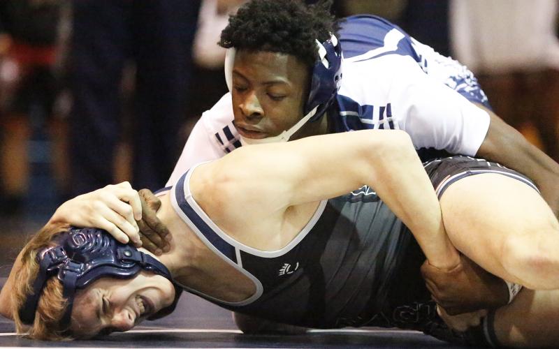 Mat Devil junior Jamal Rucker (top) defeated East Jackson’s Ryan Sparks by pin in the second round of 126-pound division of the Inferno Invitational Jan. 25 in Elberton. (Photo by Cary Best)