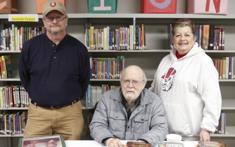 Roberta Rice (right) is pictured with council member Wade Bridges (left) and author Terry Kay at the Bowman Public Library's recent re-opening on Jan. 25.