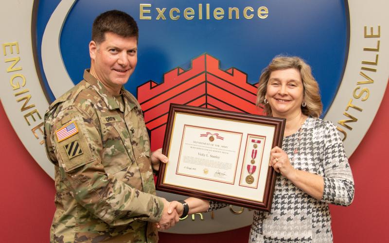 Vicky Stanley was presented the Meritorious Civilian Service Award by Col. Marvin Griffin, Commander, U.S. Army Engineering and Support Center on Jan. 13 in Huntsville, Alabama.