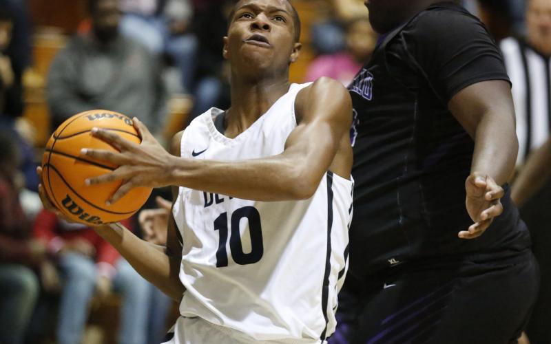 Sophomore shooting guard Jamil Burton led the Blue Devils in scoring with 21 points in Elbert County’s 71-64 first-round region tournament win over Monticello Feb. 3 at Banks County in Homer. (Photo by Cary Best)