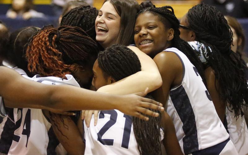 Lady Blue Devil teammates hug injured senior Maggie Campbell (center) at the conclusion of Senior Night Jan. 31 in the Inferno. (Photo by Cary Best)
