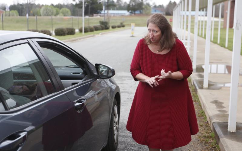 Sandee Drake, Elbert County Middle School Principal, handed out ‘grab and go’ meals last week. (Photo by Scoggins)