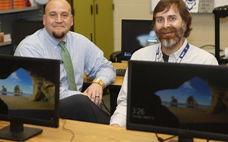 ECCHS Principal Jason Kouns chats with ECCHS teacher Nat McCarty. (Photo by Best)