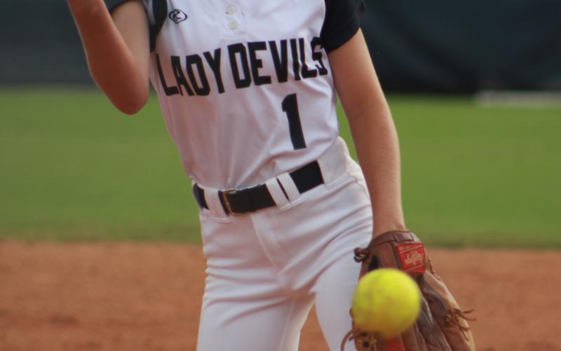 Sophomore Pitcher Jaynee Webb opened the Lady Devils softball game against Oconee Monday night at Wesley King Field. The team will travel to Prince Avenue Thursday for a 5 p.m. game. (Photo by Scoggins)