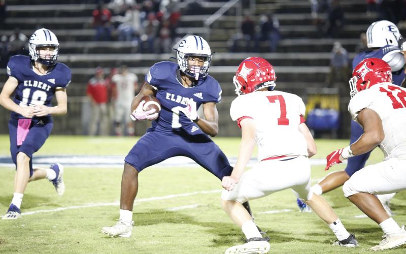 Elbert County running back Quan Moss (1) looks for running room in Elbert County’s 27-20 loss in the Historic Granite Bowl Friday night. Elbert County was on Lincoln County’s 9-yard line when time ran out. (Photo by Scoggins)