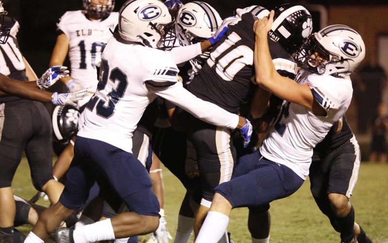 The Elbert County Blue Devil defense brings down Commerce quarterback Trey Huff. (Photo by Scoggins)