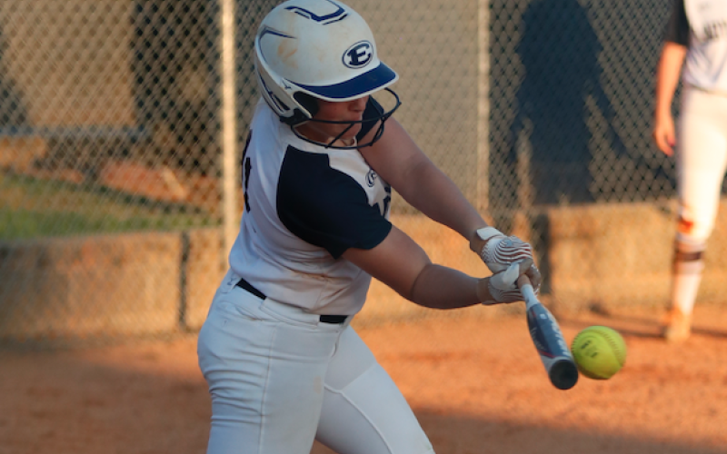 Making contact: Ellie Jourolmon rips a base hit in a contest earlier this year. The Lady Devils have a tune-up game against Social Circle Thursday prior to going into the playoffs Monday. (Photo by Scoggins)