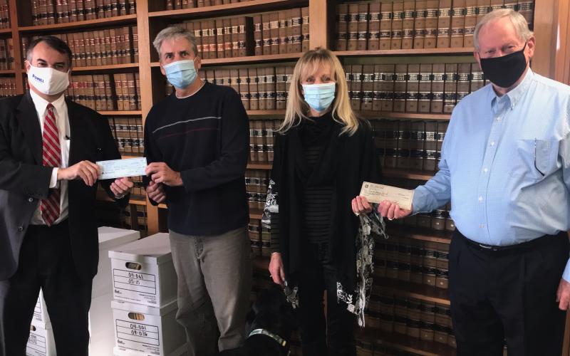 Georgia House District 33 Representative Rob Leverett (left) and Jerry Spivey (right) made a donation to Friends Helping Friends last week, using funds they would have normally spent for an annual buffet that was canceled due to COVID-19. Shown accepting donation are Jeff and Sandy Adams. (Photo by Jones)