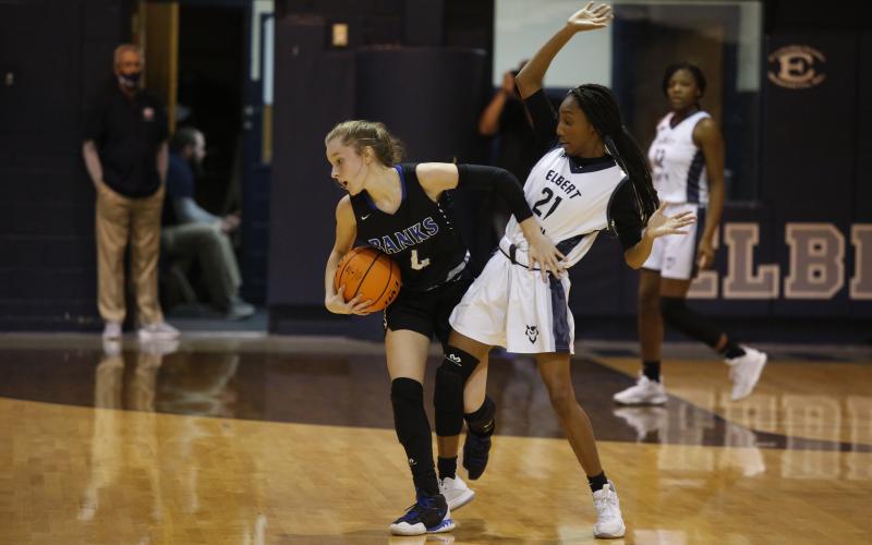 Sophomore Niya Moon attempts to block the Lady Leopards’ defense Jan. 22 in the Inferno (Photo by Scoggins)