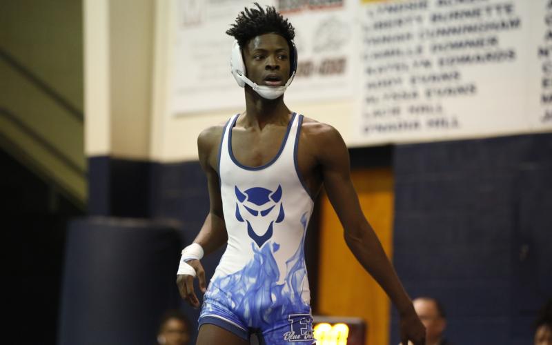 Senior Jamal Rucker won the state championship in the 126-pound division in Macon Wednesday, Feb. 10. (Photos by Scoggins)